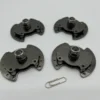Batch of custom SK7 stamped torque hinges with black nickel plating after assembly