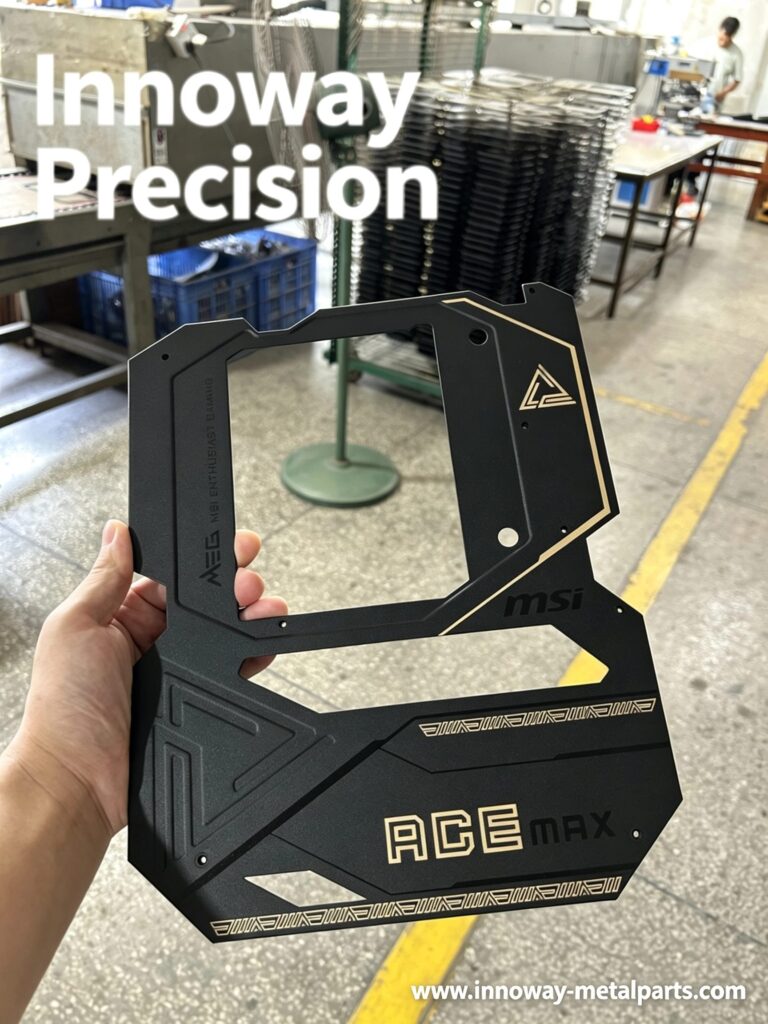 Black and gold screen printed metal panel with fine graphics for computer hardware
