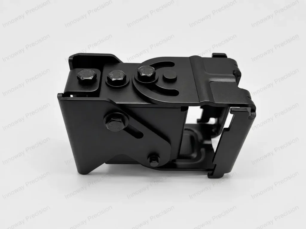 Custom monitor wall mount bracket with curved adjustment slots, pivot bolts and black-finished metal components.