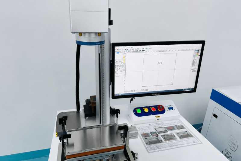 Industrial laser engraving machine used for precision marking of custom metal parts, including logos, text, and permanent identification marks.